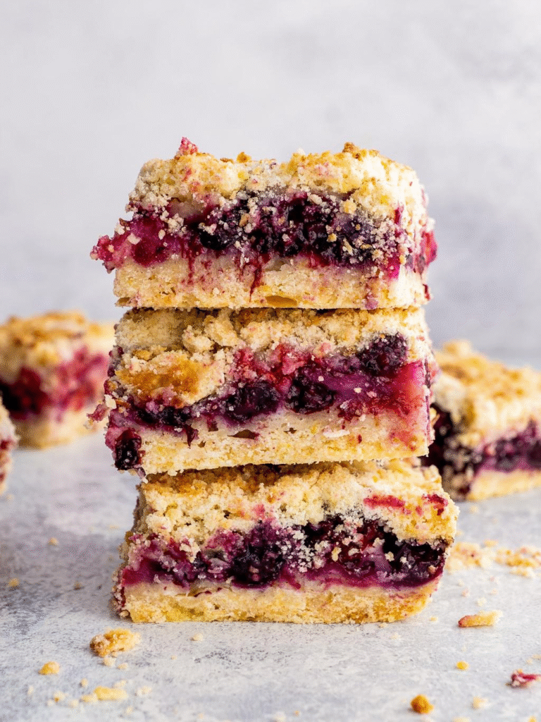These Berry Crumble Bars combine a golden oat crumble crust, a vibrant mixed berry layer, and a crumbly topping—all in one easy-to-slice dessert.
